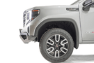 Silver GMC Sierra 1500 truck's front end showcasing a black Fab Fours Vengeance bumper guard