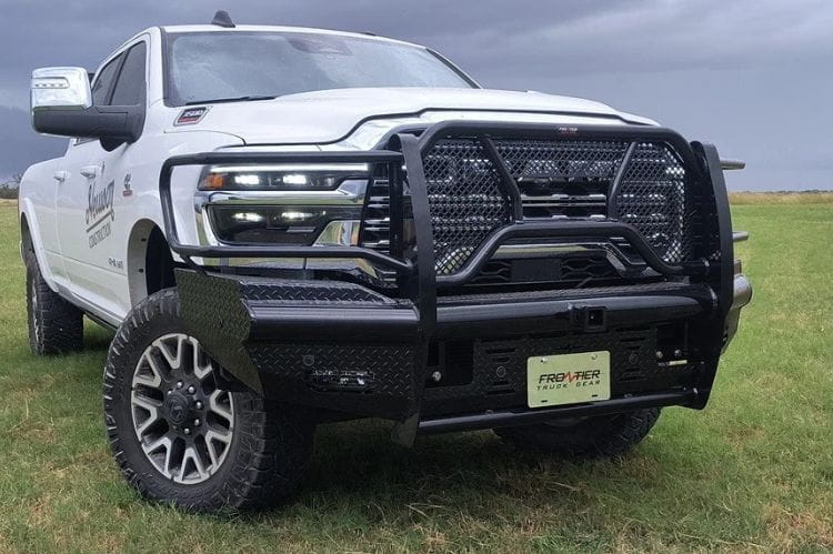 White truck with Frontier Commercial Front Bumper Replacement for 2025 Dodge Ram 2500 and 3500, heavy-duty diamond plate steel on grassy field