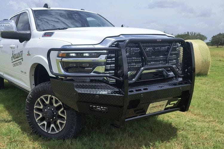 Frontier Original Series Front Bumper Replacement for 2025 Dodge Ram 2500 and 3500, heavy-duty brush guard style in an outdoor setting