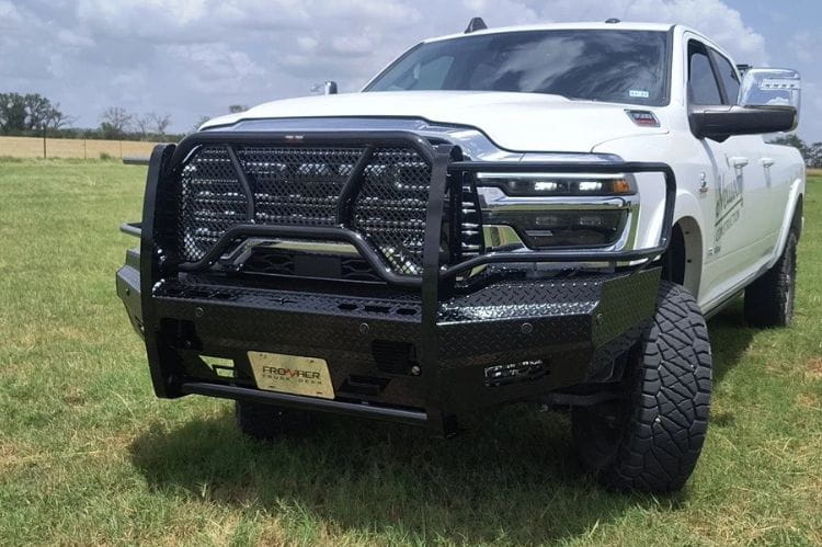Frontier Original Series Front Bumper Replacement for 2025 Dodge Ram 2500 and 3500, heavy-duty brush guard style on grass