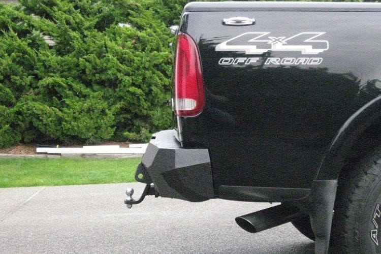 Aftermarket steel bumper #23 by Iron Bull offers maximum rear impact armor for a 1997-2003 Ford F150 off-road rig