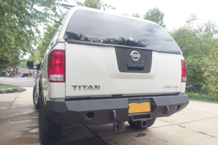 Aftermarket rear bumper #42 by Iron Bull is mounted on the back end of a 2004-2015 Nissan Titan pickup truck