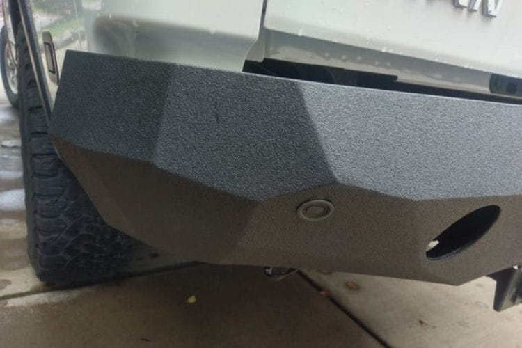 Aftermarket rear bumper #42 by Iron Bull is mounted on the back end of a 2004-2015 Nissan Titan pickup truck