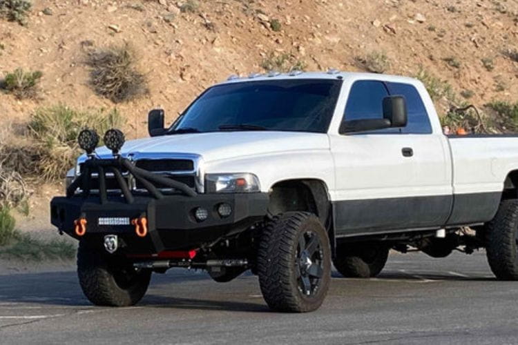 Iron Bull front bumper #14 equips a 1994-2002 Dodge Ram 2500/3500 with heavy-duty steel guard on rugged off-road trails