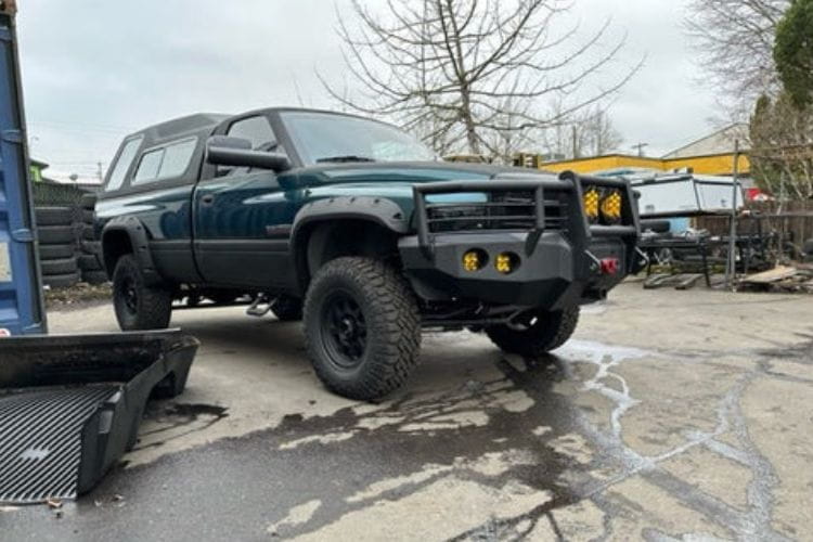 Iron Bull front bumper #14 equips a 1994-2002 Dodge Ram 2500/3500 with heavy-duty steel guard on rugged off-road trails