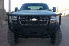 Iron Bull aftermarket front bumper for 2003-2007 Chevy Silverado 2500/3500, heavy-duty steel construction with bold upgrade design.