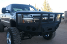 Iron Bull aftermarket front bumper for 2003-2007 Chevy Silverado 2500/3500, heavy-duty steel construction with bold upgrade design.