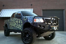Heavy duty front bumper #21 by Iron Bull displays a black steel finish on a 2004-2008 Ford F150 rugged work truck 