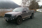 Heavy duty front bumper #21 by Iron Bull displays a black steel finish on a 2004-2008 Ford F150 rugged work truck 
