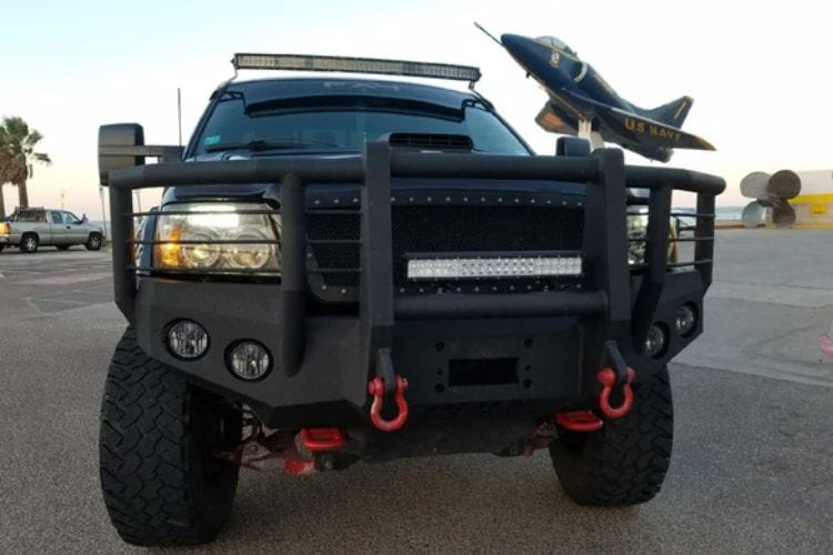 Heavy duty front bumper #21 by Iron Bull displays a black steel finish on a 2004-2008 Ford F150 rugged work truck 