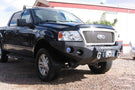 Heavy duty front bumper #21 by Iron Bull displays a black steel finish on a 2004-2008 Ford F150 rugged work truck 