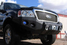 Heavy duty front bumper #21 by Iron Bull displays a black steel finish on a 2004-2008 Ford F150 rugged work truck 