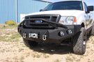 Heavy duty front bumper #21 by Iron Bull displays a black steel finish on a 2004-2008 Ford F150 rugged work truck 