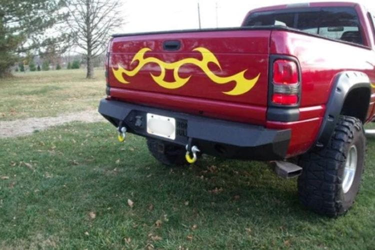 Heavy duty rear bumpers #16 made by Iron Bull enhance a 1994-2002 Dodge Ram 2500/3500 with rugged trail-ready protection