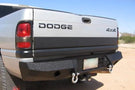 Heavy duty rear bumpers #16 made by Iron Bull enhance a 1994-2002 Dodge Ram 2500/3500 with rugged trail-ready protection