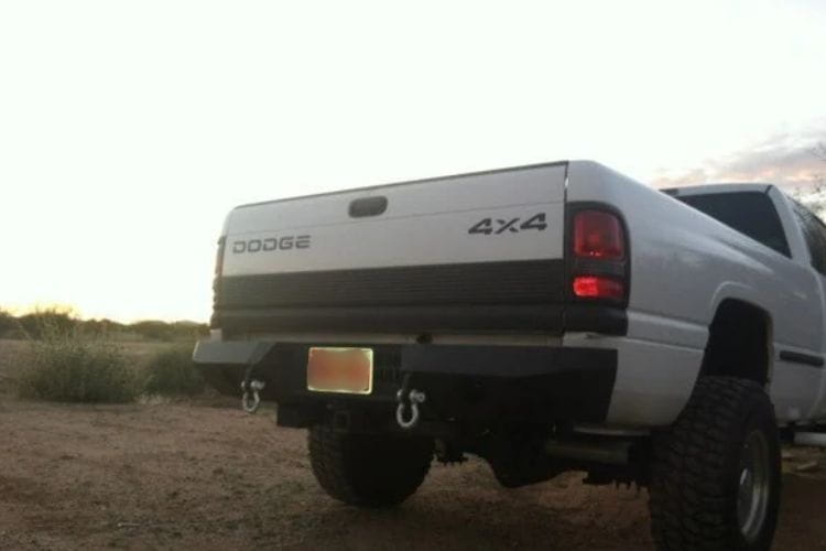 Heavy duty rear bumpers #16 made by Iron Bull enhance a 1994-2002 Dodge Ram 2500/3500 with rugged trail-ready protection