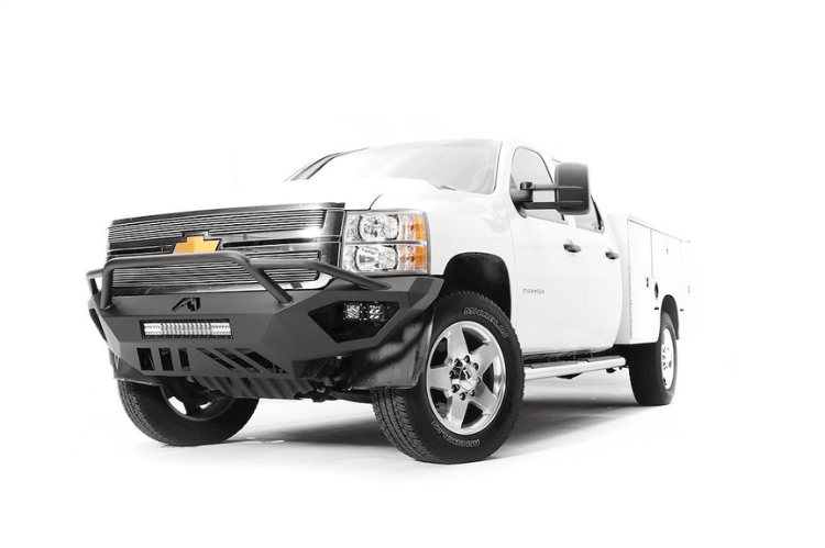 Night Raider Kit installed on a 2014 Silverado 2500HD to turn the truck into a night beast with heavy-duty Fab Fours bumpers and Rigid LED lighting