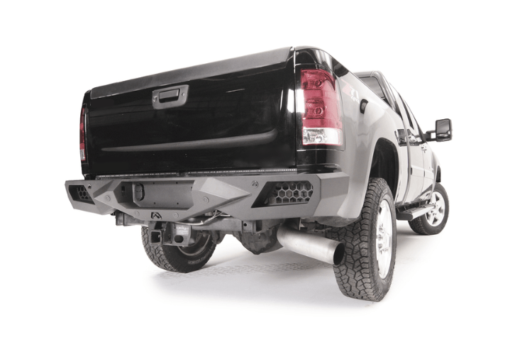 Night Raider Kit installed on a 2014 Silverado 2500HD to turn the truck into a night beast with heavy-duty Fab Fours bumpers and Rigid LED lighting