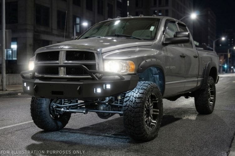 2005 Dodge Ram 2500 Bumper Night Raider kit featuring Hammerhead Bumpers and Rigid lights for rugged truck protection