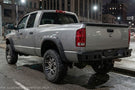 2005 Dodge Ram 2500 Bumper Night Raider kit featuring Hammerhead Bumpers and Rigid lights for rugged truck protection