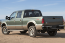 Overland Adventure Kit for a 2004 Ford F250, optimized for heavy-duty service with Hammerhead bumpers, Warn winch, Truxedo rack and ARB roof tent.