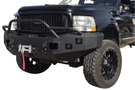 Overland Adventure Kit for a 2004 Ford F250, optimized for heavy-duty service with Hammerhead bumpers, Warn winch, Truxedo rack and ARB roof tent.