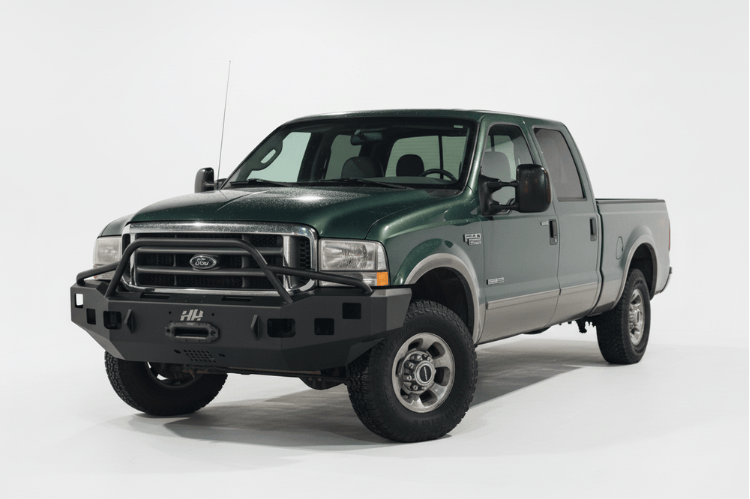 Overland Adventure Kit for a 2004 Ford F250, optimized for heavy-duty service with Hammerhead bumpers, Warn winch, Truxedo rack and ARB roof tent.