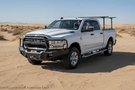 Overland Adventure Kit for a 2024 Dodge Ram 2500, engineered for extreme-duty demands with Fab Fours bumpers, Warn winch, Truxedo rack  and ARB rooftop tent.