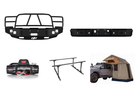 2014 Chevy Silverado 2500HD Overland Adventure Kit ready for off-road exploration with Hammerhead bumpers, Warn winch, TruXedo rack, and an ARB rooftop tent