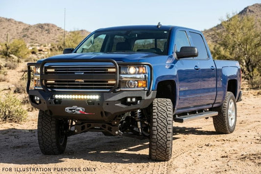 Overland Adventure Kit on 2019 Chevy Silverado 2500HD featuring Fab Fours bumpers, Warn winch, TruXedo rack, and ARB rooftop tent for off-road exploration.