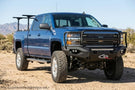 Overland Adventure Kit on 2019 Chevy Silverado 2500HD featuring Fab Fours bumpers, Warn winch, TruXedo rack, and ARB rooftop tent for off-road exploration.