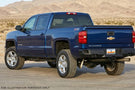 Overland Adventure Kit on 2019 Chevy Silverado 2500HD featuring Fab Fours bumpers, Warn winch, TruXedo rack, and ARB rooftop tent for off-road exploration.