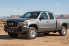 2007 GMC Sierra 2500HD Overland Adventure Kit with Hammerhead bumpers, Warn winch, TruXedo rack and, ARB Rooftop Tent.