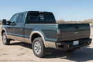 Overland Adventure Kit for a 2007 Ford F250 Superduty, engineered for extreme off-road duty with Hammerhead bumpers, Warn winch, Truxedo rack and ARB roof tent.