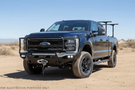 2023 F250 Superduty Overland Adventure Kit featuring Fab Fours bumpers, Warn winch, Truxedo rack and ARB roof tent ready for off-road adventures.