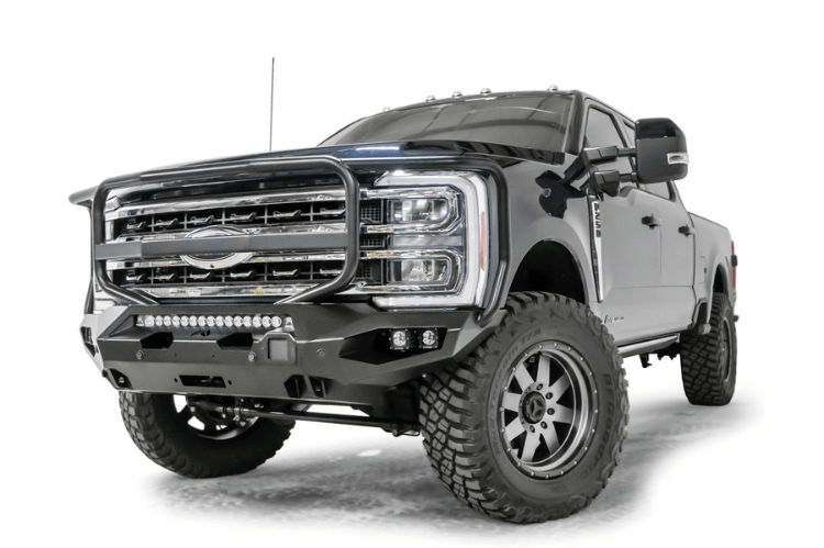 2023 F250 Superduty Overland Adventure Kit featuring Fab Fours bumpers, Warn winch, Truxedo rack and ARB roof tent ready for off-road adventures.