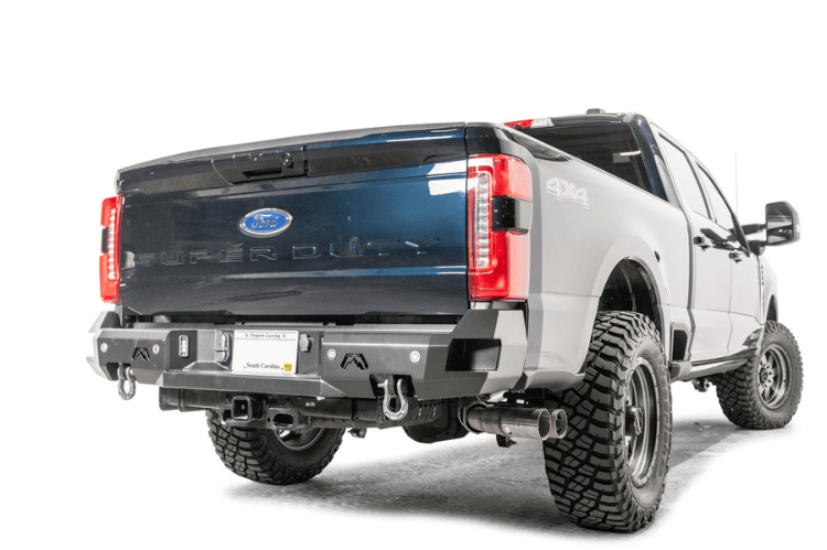 2023 F250 Superduty Overland Adventure Kit featuring Fab Fours bumpers, Warn winch, Truxedo rack and ARB roof tent ready for off-road adventures.