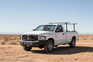 Overland Adventure Kit for a 2009 Dodge Ram 2500, developed for high-impact use with Hammerhead bumpers, Warn winch, Truxedo rack and ARB rooftop tent.