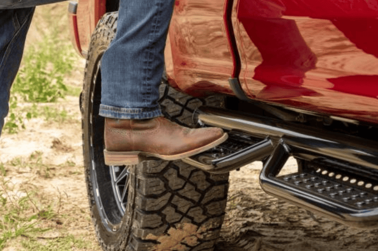 Ranch Hand Legend running steps RSD101C6B6S installed on a Dodge Ram 1500 for sturdy side access and rugged truck styling.