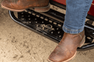 Ranch Hand Legend running steps RSD101C6B6S installed on a Dodge Ram 1500 for sturdy side access and rugged truck styling.