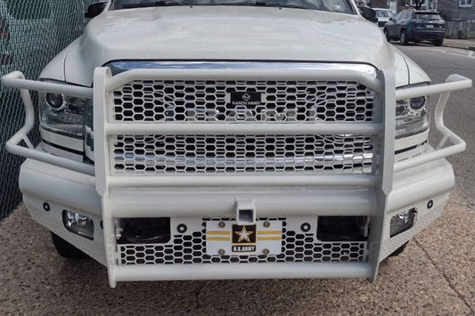 Ranch Hand FBD101BLRS Legend front bumper on white 2010-2018 Dodge Ram 2500 heavy duty truck on a street.