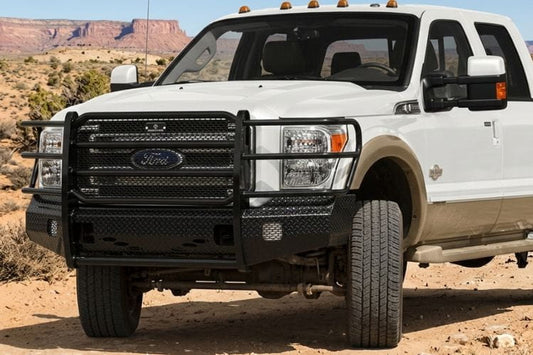 Ranch Hand FSF111BL1 front bumper for 2011–2016 Ford F250 and F350 Super Duty trucks in a desert landscape with mountains in the background