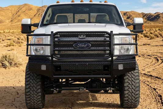 Front view of Ranch Hand FSF111BL1 front bumper for 2011–2016 Ford F250 and F350 Super Duty trucks on a desert landscape