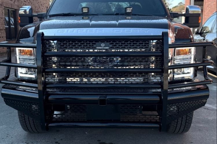 Ranch Hand Legend front bumper grille guard Ford F250 Superduty XLT 2008-2010 angled front view in an outdoor setting.