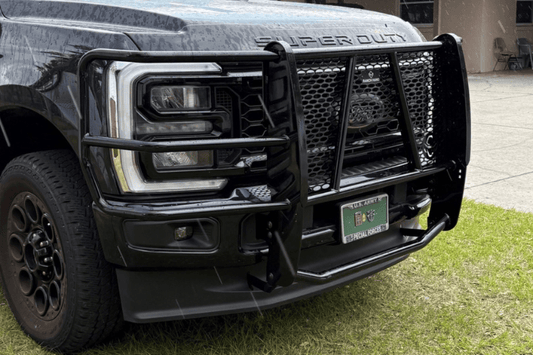 Close-up of a Ranch Hand Legend Series Grille Guard for 2023-2026 Ford F250 and F350 Super Duty, heavy-duty black pipe steel