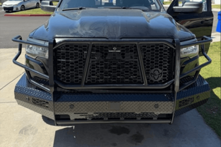 Ranch Hand Summit front bumper grille guard on Ram 1500 Rebel 2025-2026 angled front view on a street.