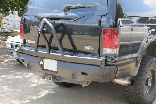 Road Armor Stealth 61208B rear bumper replacement with spare tire carrier for 1999-2007 Ford Excursion – heavy-duty back bumper with rear winch mount, textured black finish, winch-ready design