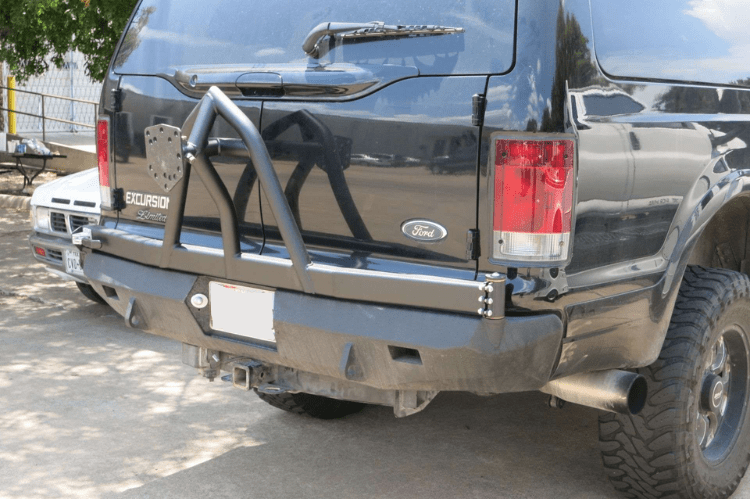 Road Armor Stealth 61208B rear bumper replacement with spare tire carrier for 1999-2007 Ford Excursion – heavy-duty back bumper with rear winch mount, textured black finish, winch-ready design