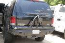 Road Armor Stealth 61208B rear bumper replacement with spare tire carrier for 1999-2007 Ford Excursion – heavy-duty back bumper with rear winch mount, textured black finish, winch-ready design