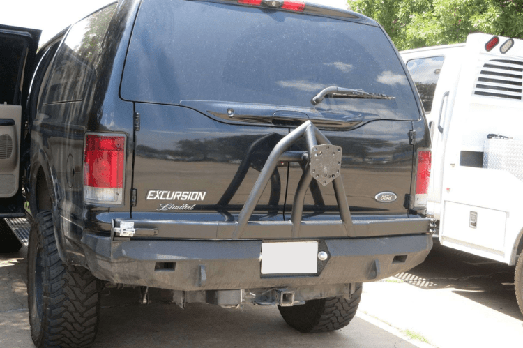 Road Armor Stealth 61208B rear bumper replacement with spare tire carrier for 1999-2007 Ford Excursion – heavy-duty back bumper with rear winch mount, textured black finish, winch-ready design
